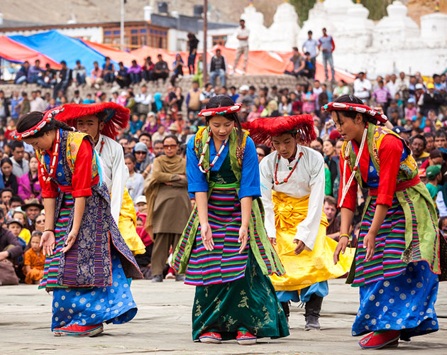 Ladakhi people perform a dance