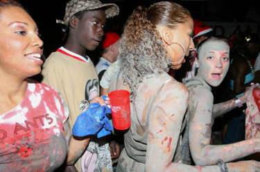 Revellers slathered in something at J'Ouvert